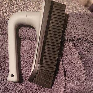 Gray and Black Grooming Brush